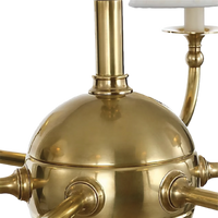 Acres Market & Interiors Embers 41" Chandelier, polished brass, spherical body with radiating arms and candle-style lights.