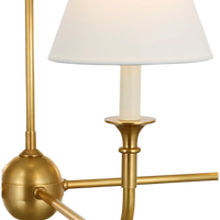 Acres Market & Interiors brass chandelier with six white linen shades and polished finish. Classic, minimalist design.