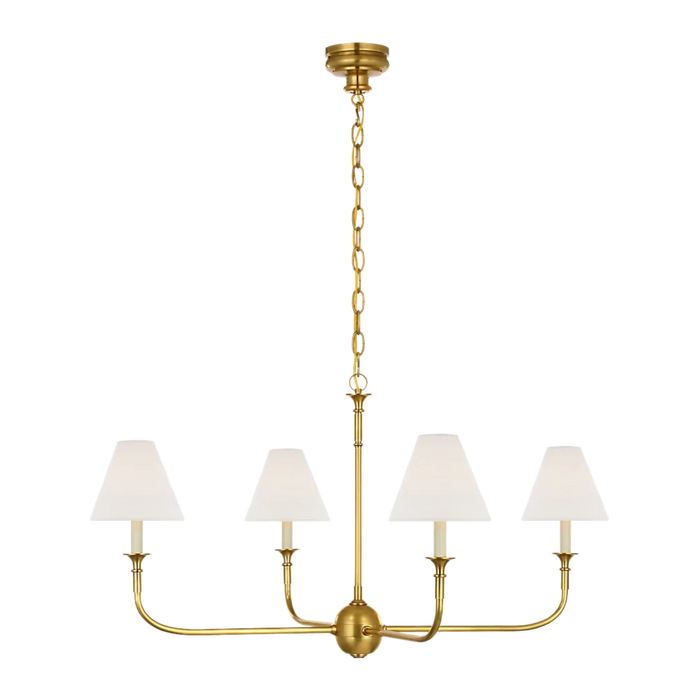 Acres Market & Interiors brass chandelier with four white linen shades and adjustable chain, classic design.