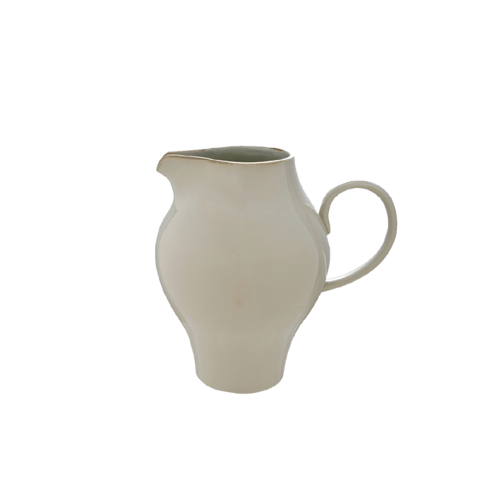 Beige ceramic pitcher on a white background